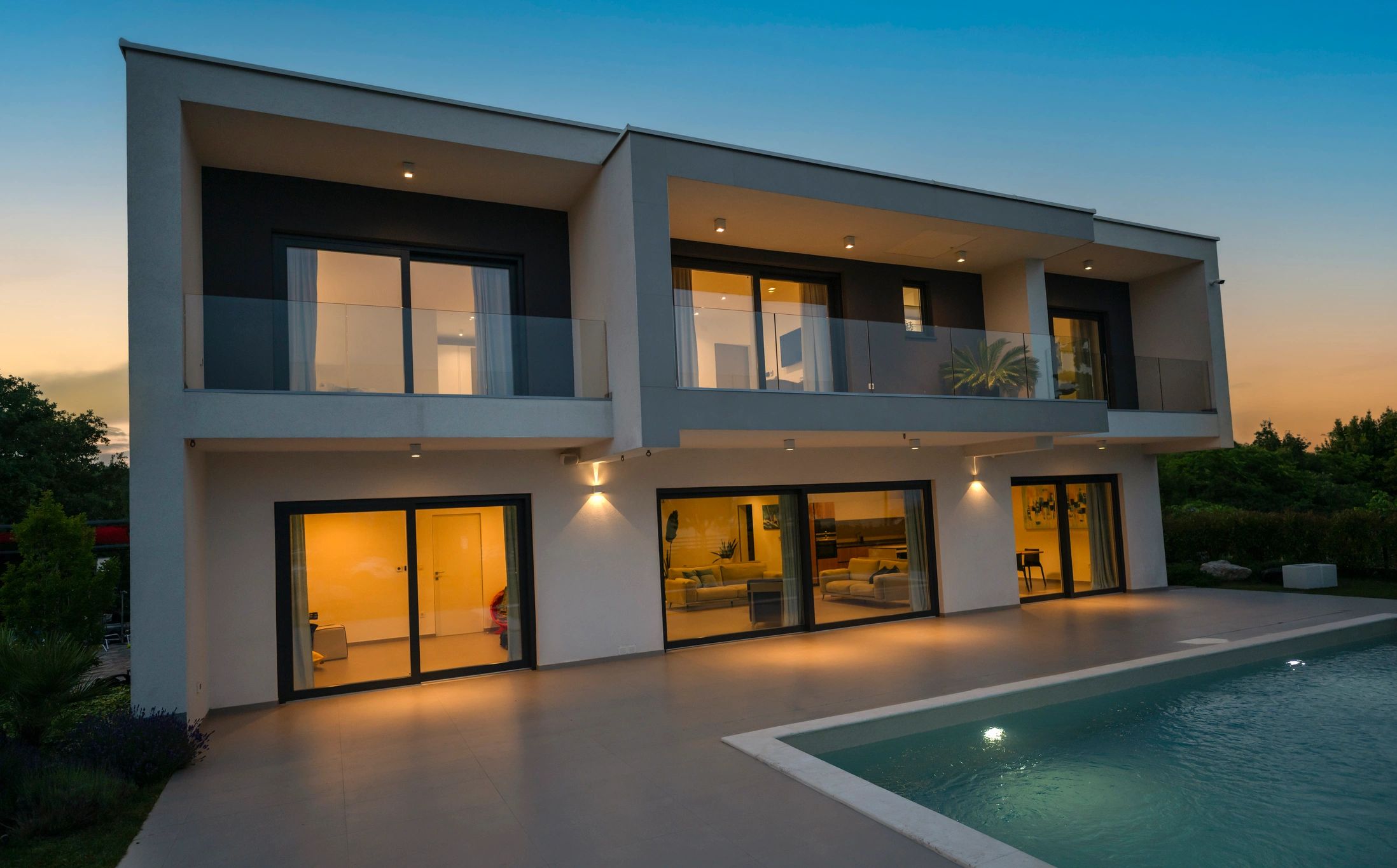 Illuminated modern luxury residence at dusk